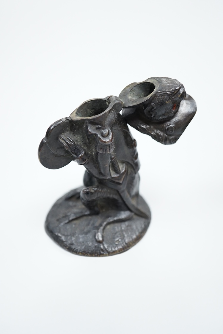 A novelty dog's head Pastille burner and bronze monkey, largest 11cm wide